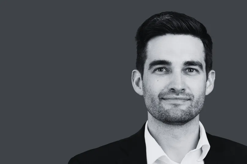 A person sitting at a desk in front of a computer